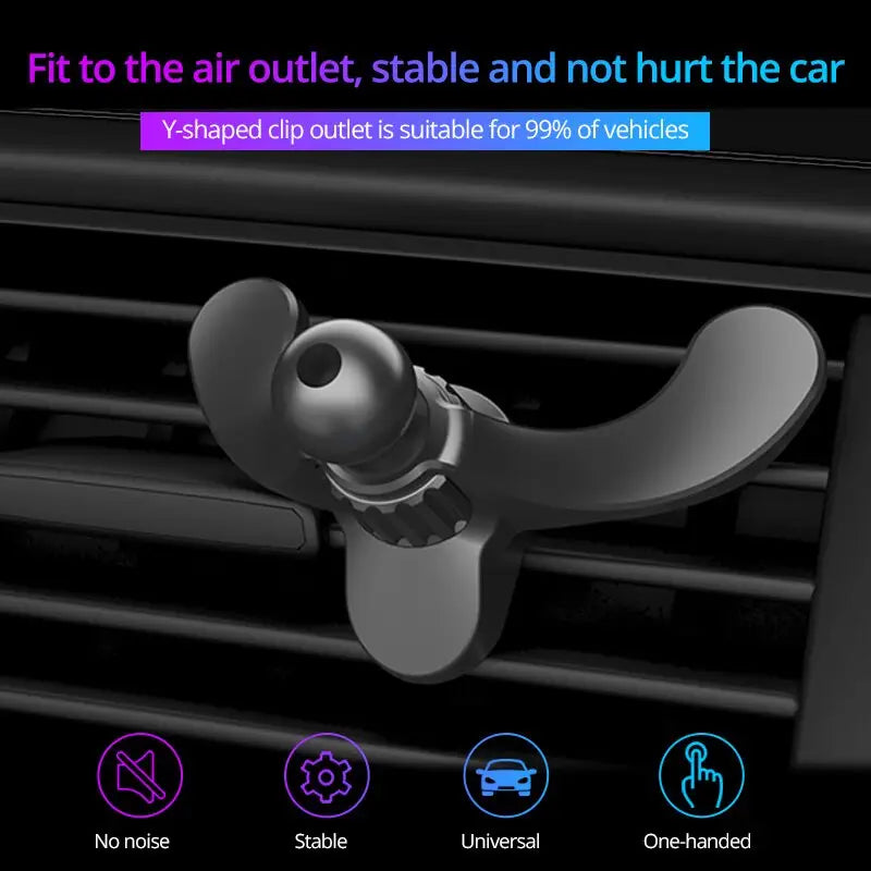 a close up of a car air vent holder with a phone in it