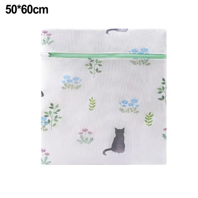 a white bag with a cat and flowers on it