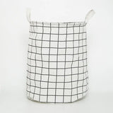 a close up of a white and black basket with a handle