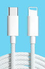 a close up of a white usb cable connected to a charger