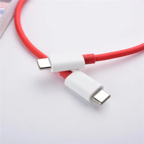 there is a red and white cable connected to a white phone