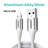 A close up of a white cable connected to a micro usb