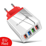 a white and red usb charger with four different ports