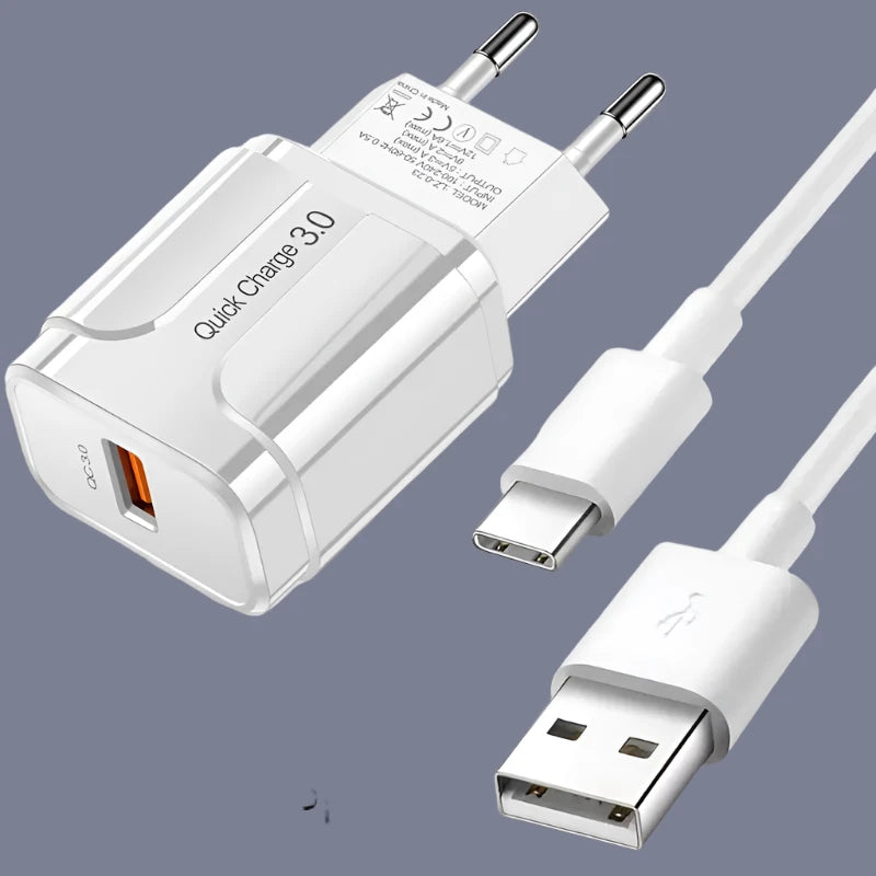 a close up of a white charger and a cable connected to a phone