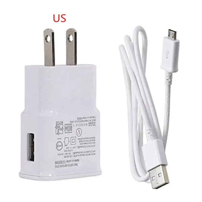 a close up of a white charger and a usb cable