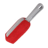 a close up of a red and white cleaning brush with a white handle
