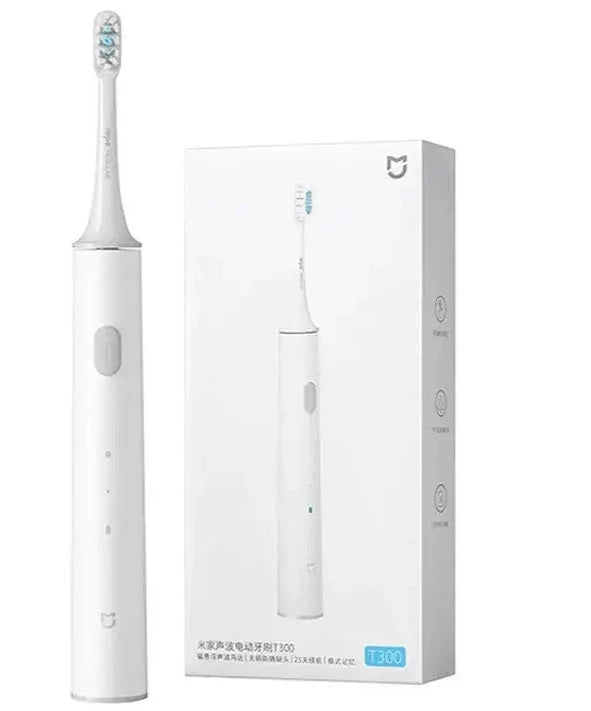 A close up of a white electric toothbrush in a box