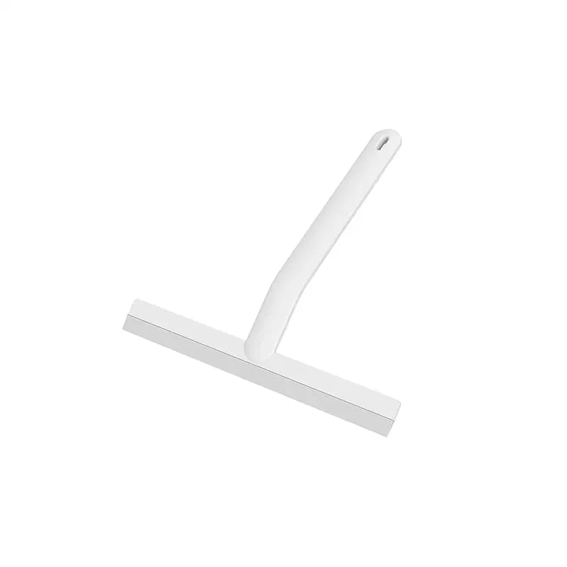 a close up of a white plastic handle on a white surface