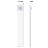 A close up of a white phone with a white stick