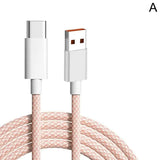 a close up of a white and pink cable connected to a phone