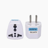 A close up of a white plug with a blue label on it