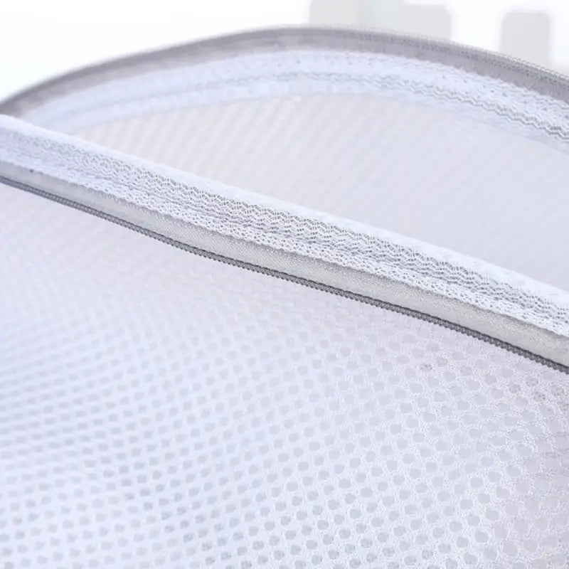 a close up of a white mesh bag