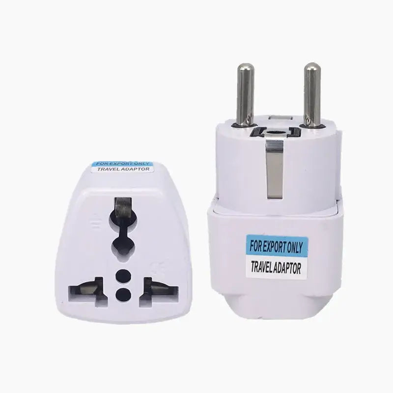 a close up of a white travel adapter with two plugs