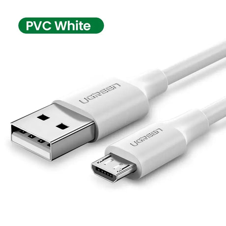 A close up of a white usb cable connected to a white phone