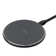 a close up of a wireless charger on a white surface