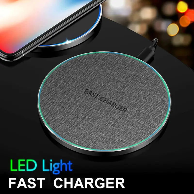a close up of a wireless charger on a table with a phone