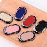 several different colors of makeup are arranged on a wooden tray