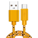 a close up of a yellow and black braided usb cable