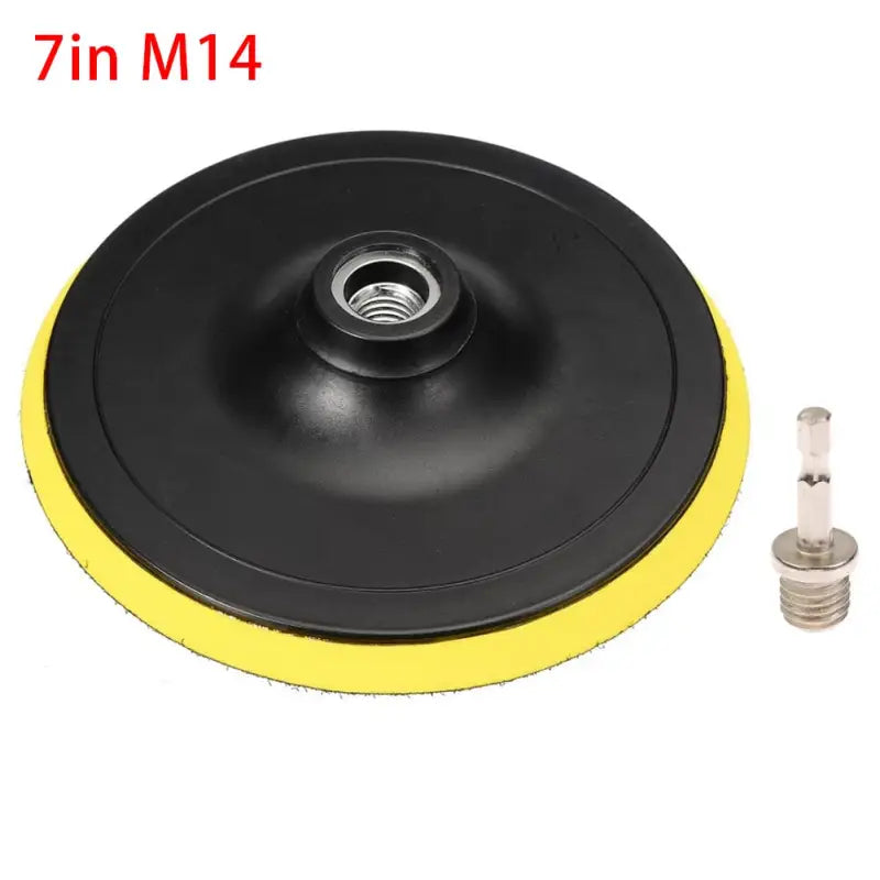 a close up of a yellow and black polishing pad with a screw