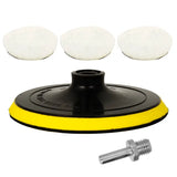 a pair of white foam pads and a black plastic disc