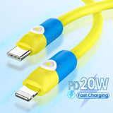 a close up of a yellow and blue usb cable connected to a computer