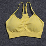 a close up of a yellow bra top on a carpet