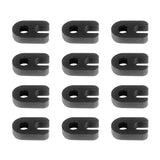 a close up of a bunch of black plastic clips on a white surface