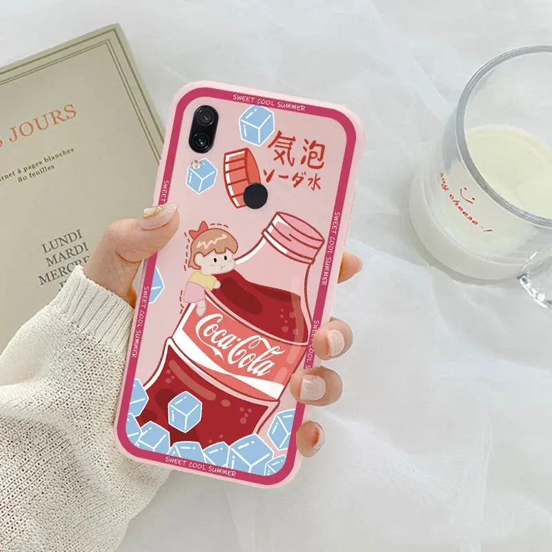 a woman holding a coca bottle phone case