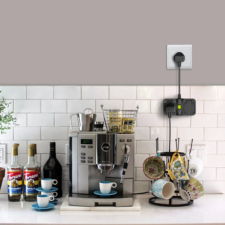 a coffee maker and cups on a counter