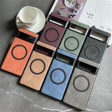 Collection of colorful phone cases or holders with circular cutouts arranged on a surface.