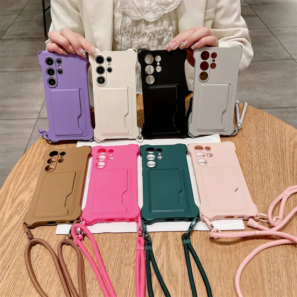 A collection of colorful smartphone cases with card slots and lanyards.
