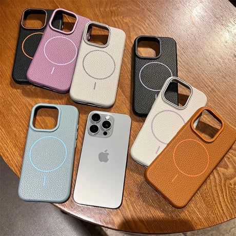 A collection of iPhone cases in various colors, featuring a textured finish and a circular magnetic element.