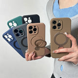 A collection of solid-colored iPhone cases with integrated magnetic rings and kickstands.