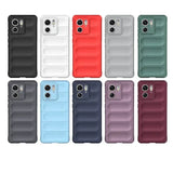 A collection of ten smartphone cases in various colors, featuring a camera cutout and a textured, ribbed design for enhanced grip.