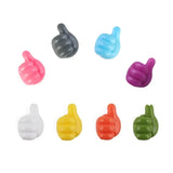 a set of six plastic thumbs