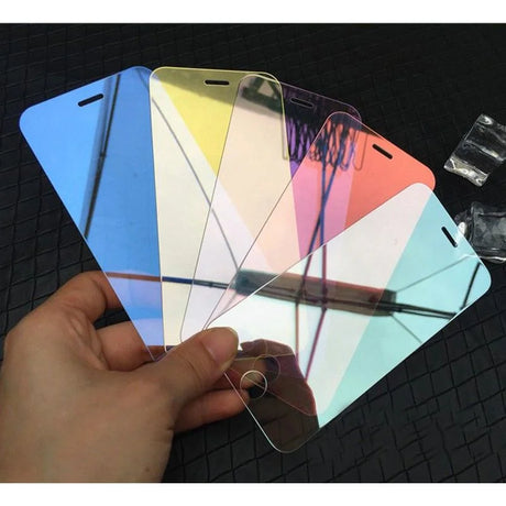 Colorful array of smartphone screen protectors held in a hand.