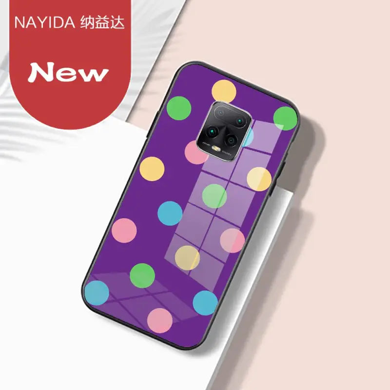 a purple phone case with colorful polka dots on it