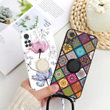 a hand holding a phone case with a flower design