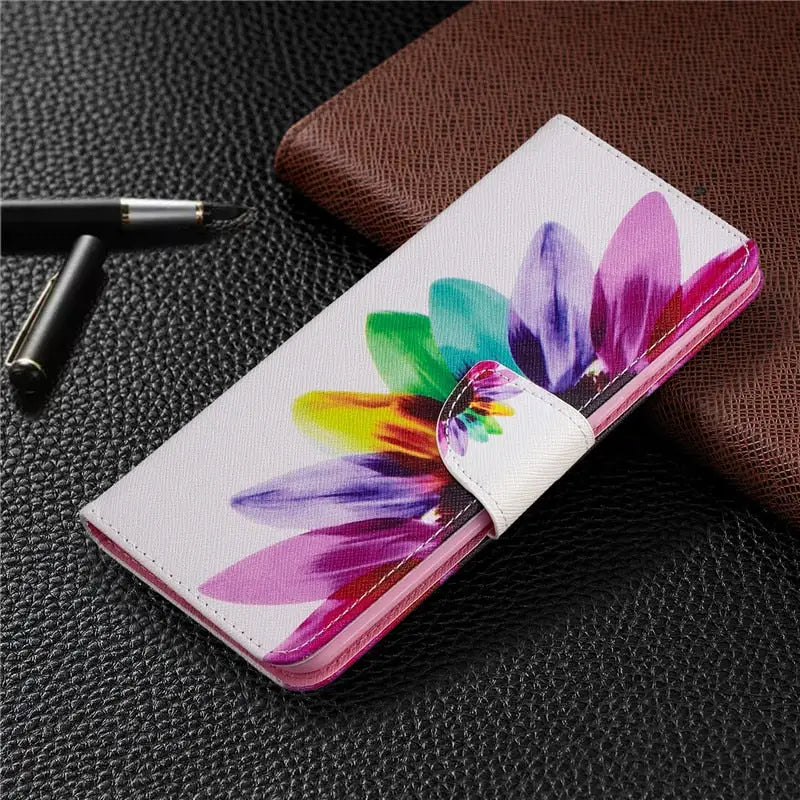a flower painted on a white leather wallet case