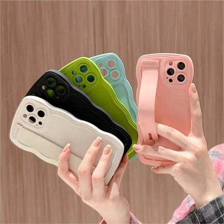 Colorful phone cases with wrist straps.