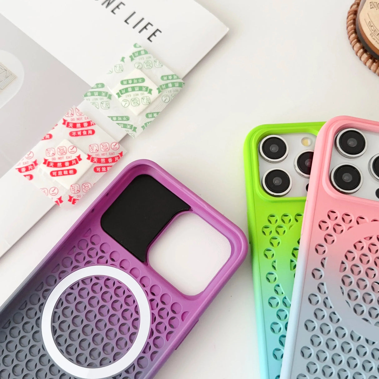 Colorful protective phone cases with patterned designs and camera cutouts.