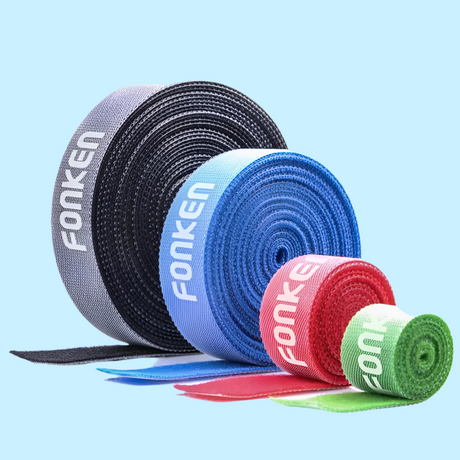 Colorful rolls of cable management straps labeled ’Fonken’.