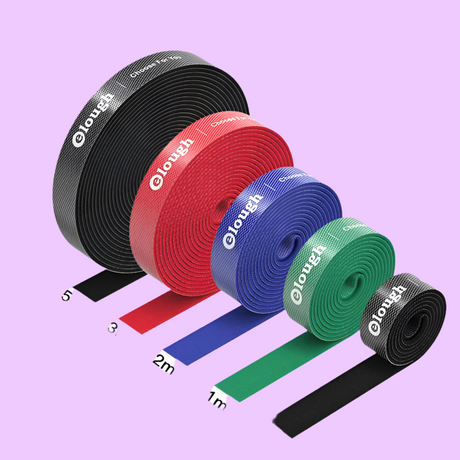 Colorful rolls of hook-and-loop fastener tape in various widths.