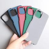 Colorful smartphone cases fanned out and held in a hand.