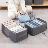 a woman sitting on the floor with four pairs of socks