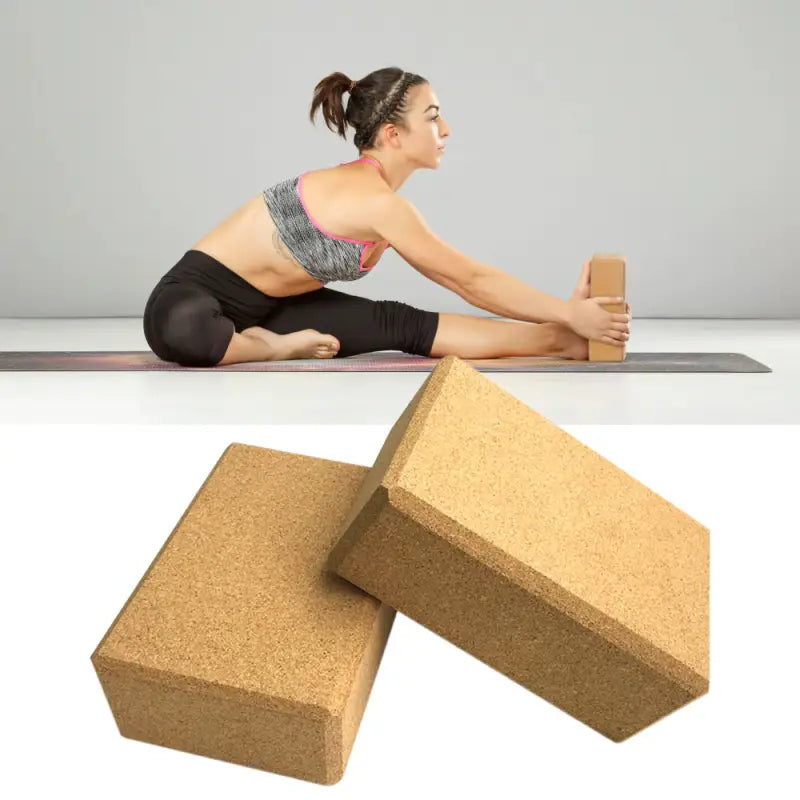 a woman doing yoga on a block