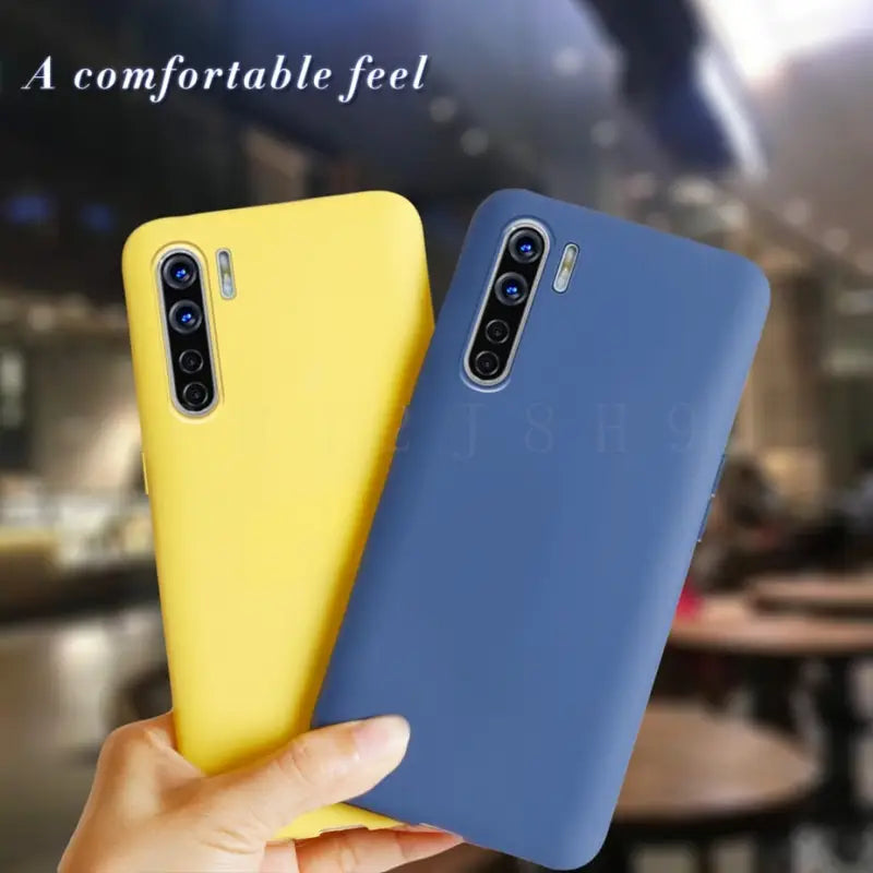 a hand holding a yellow and blue case