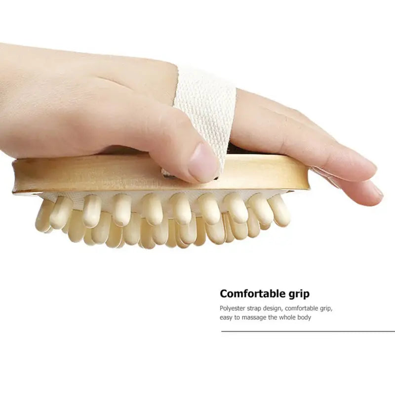a hand holding a tooth with bandages on it