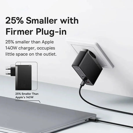 Compact black charger plug with a cable connected to a laptop.