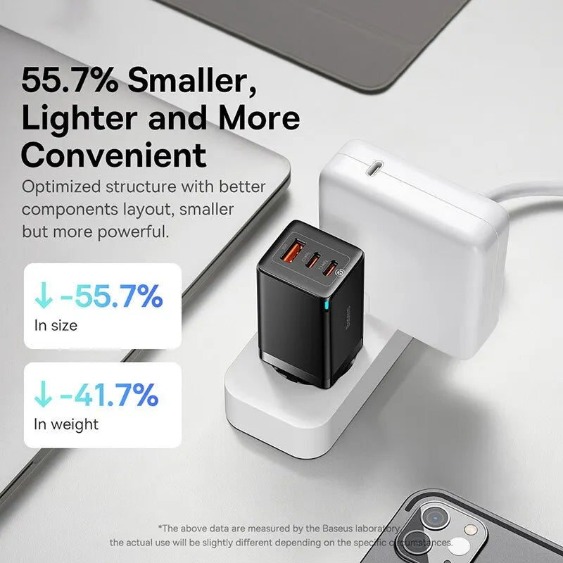Compact black USB charger with multiple ports for electronic devices.
